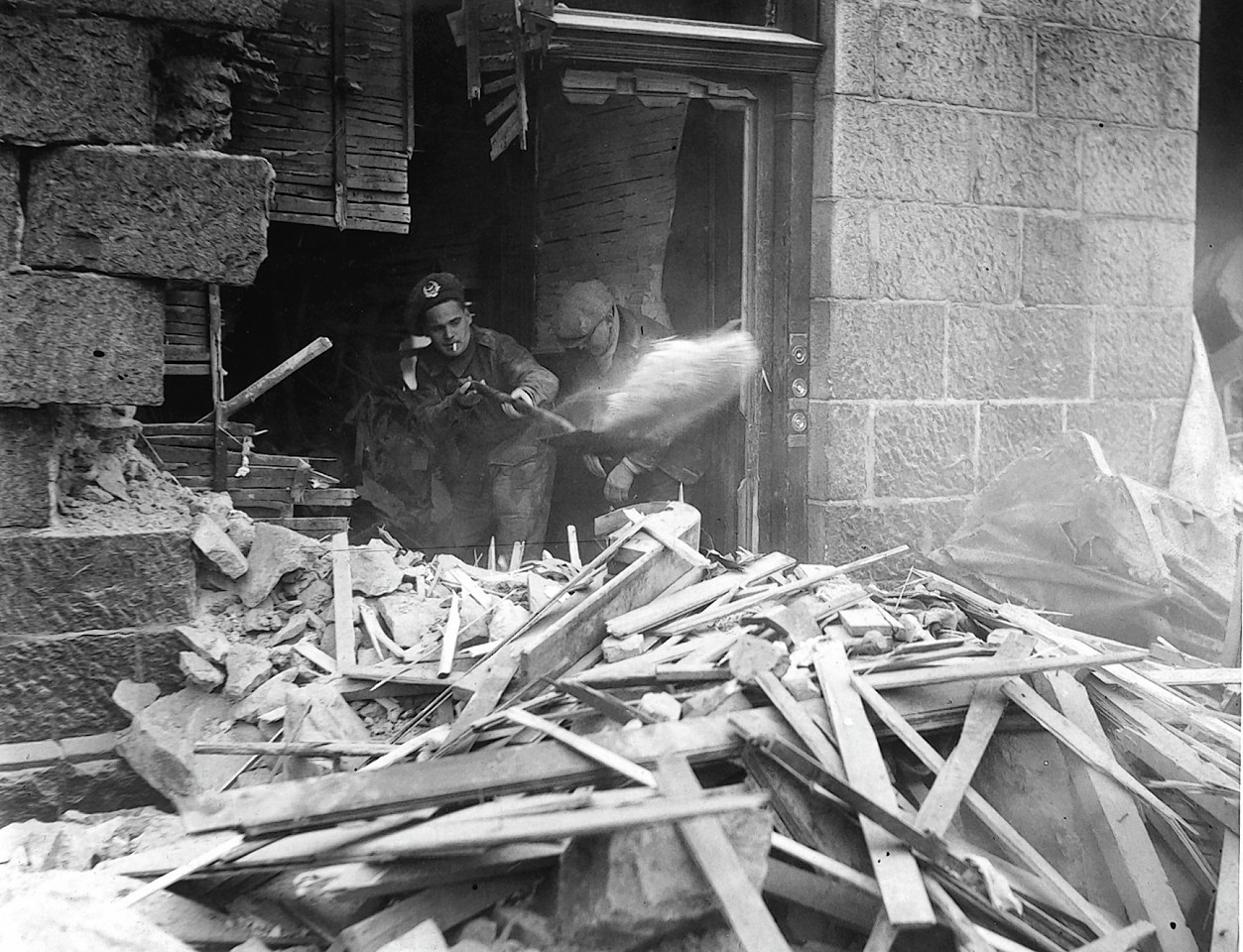 Clearing up after an air raid at Bedford Road, Aberdeen in April 1943.