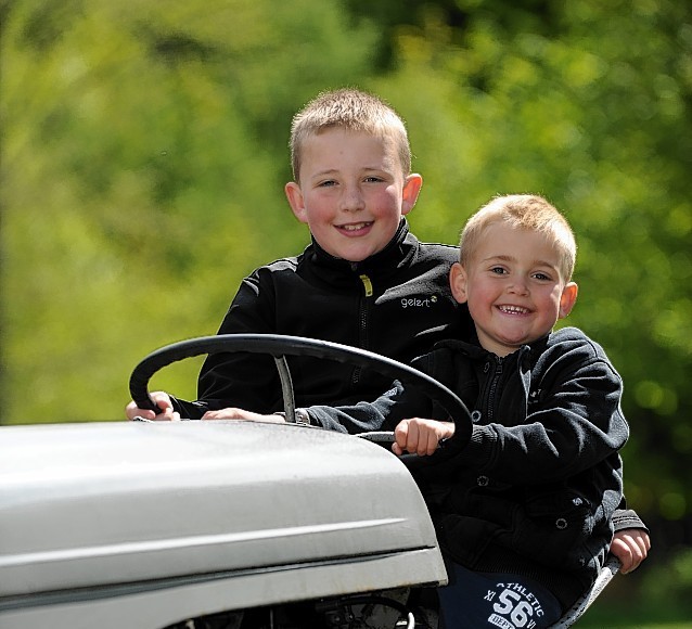 Pitgaveny Farm Open Day. Brothers Liam, left, and Callum, right,  Barrowdale on a tractor.
Picture by Gordon Lennox