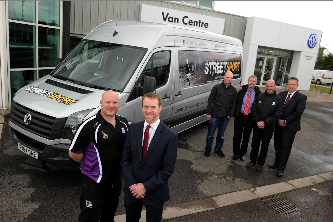 John Clark Motor Group has provided the Denis Law Legacy Trust and Robert Gordon University (RGU) Streetsport initiative with a brand new van which will enable the team to extend its sessions and continue with the delivery of activities for the foreseeable future.
Picture of (L-R) Mark Williams (Streetsport Development Officer), Chris Clark (Operations Director at John Clark Motor Group), John Welsh, David Suttie (Denis Law Legacy Trust Trustee), Filippo Antoniazzi (Director of RGU Sport) and Rob McWillaim.