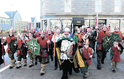 Guizer Jarl Neil Robertson with his squad of Vikings outside Skene House, Aberdeen