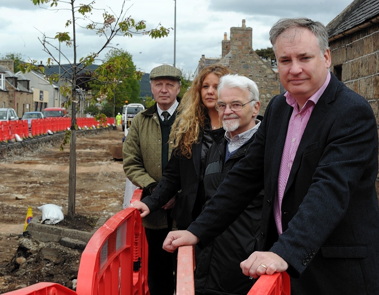 MSP Richard Lochhead with locals at the scene of the Aberlour works