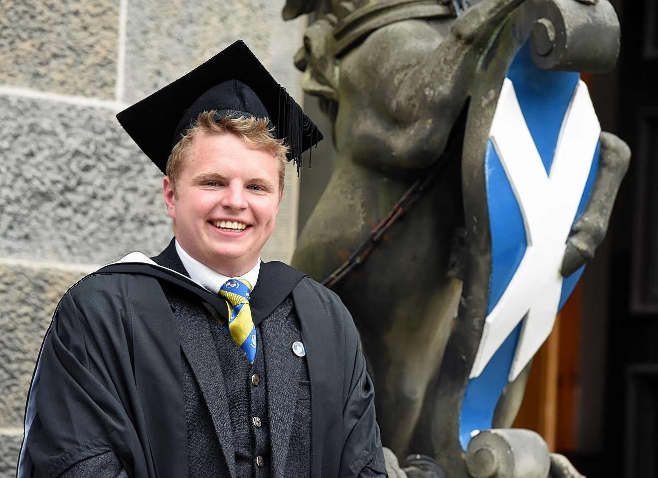 Andrew Mustard celebrates graduating. Picture by Jim Irvine