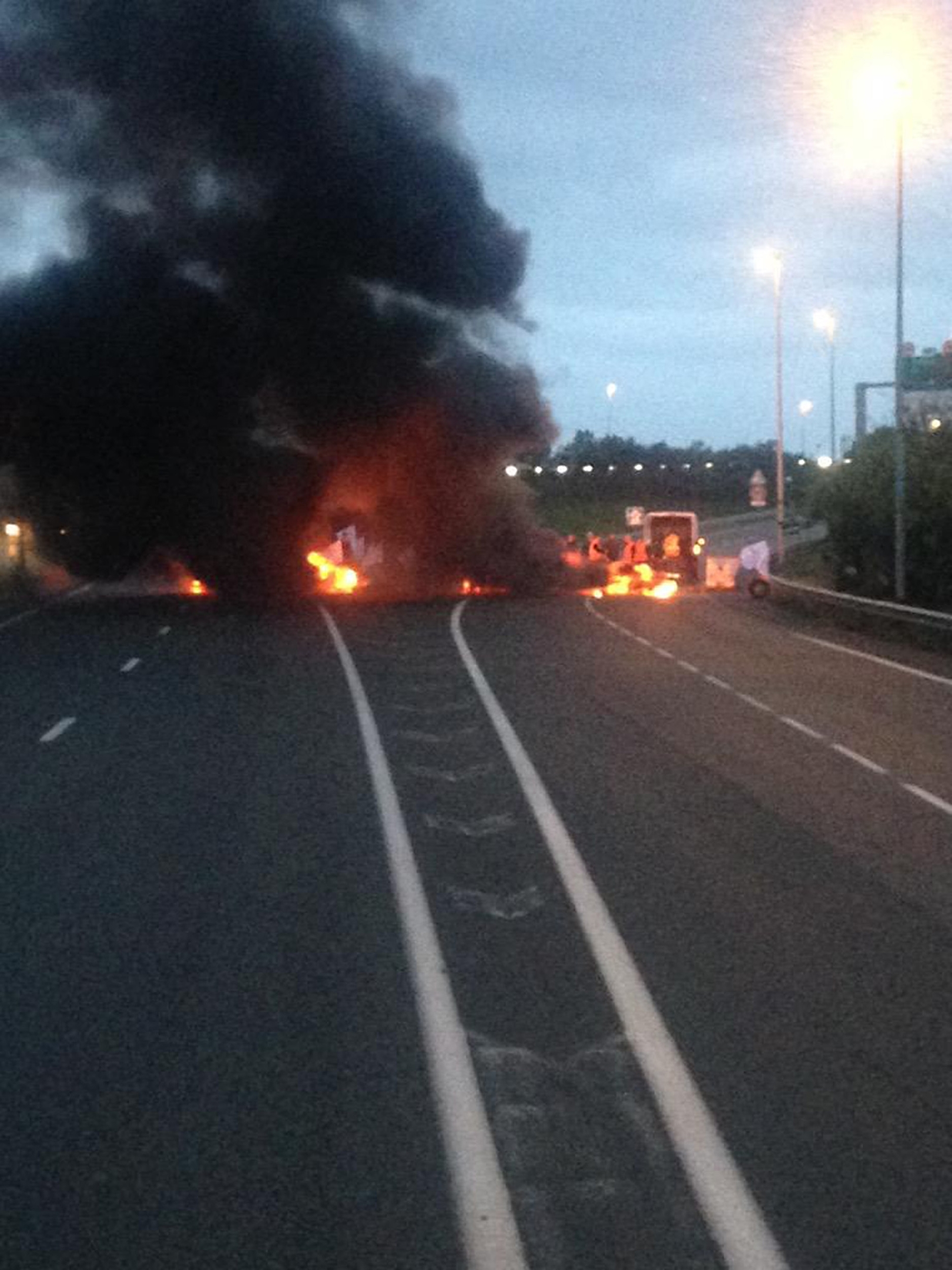 Burning blockade as French ferry workers strike in Calais. Picture from @chriscary180605