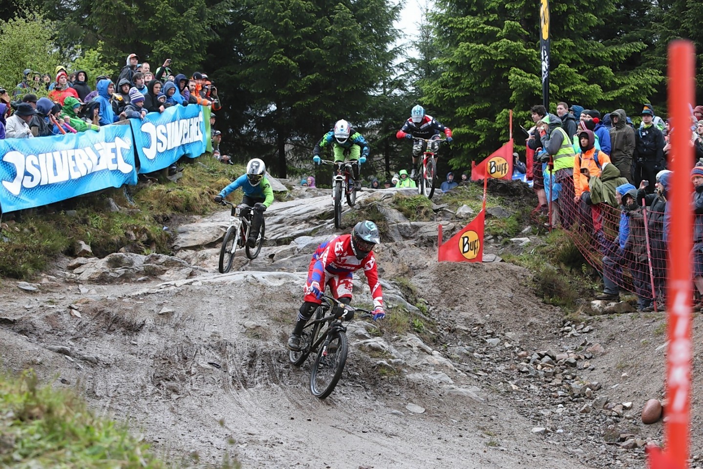 Riders compete on the 4X Pro Tour event at Fort William.