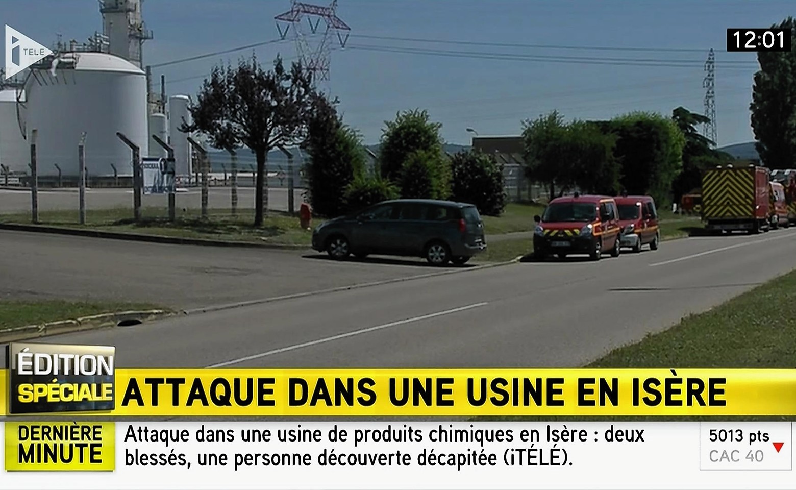 Emergency services at the scene outside a factory where a man was allegedly beheaded, in Saint-Quentin-Fallavier, France
