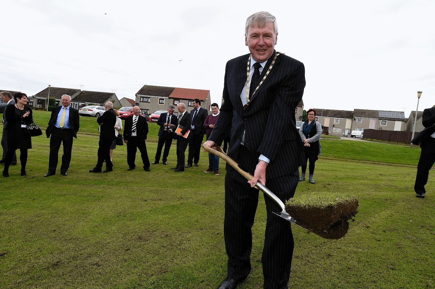 Provost Hamish Vernal cut the first sod