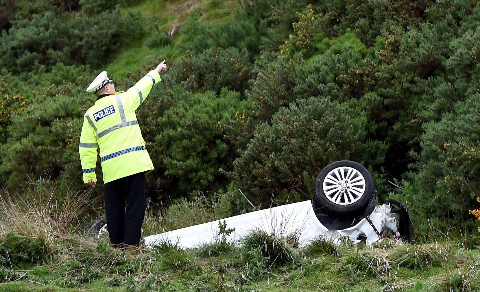 Policeman at the scene the crash, near Inverbervie. 
Picture by Kevin Emslie