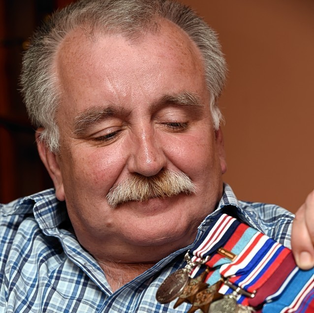 Michael Taylor with his grandfather's medals. Picture by Gordon Lennox