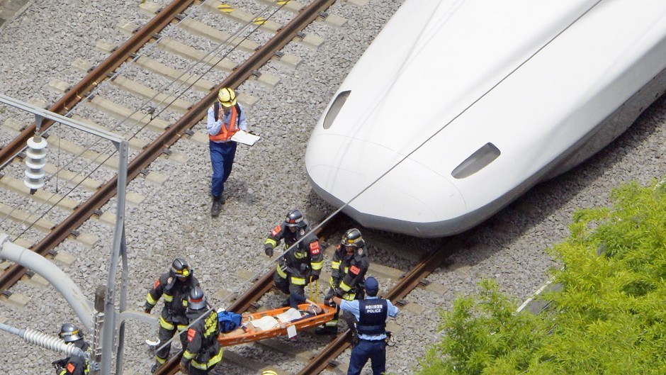 A passenger is carried out of the bullet train, which made an emergency stop in Odawara, west of Tokyo (Kyodo News/AP)