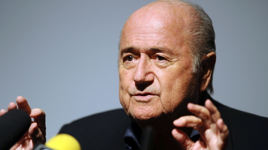 Under-fire Fifa president Sepp Blatter was re-elected on Friday
