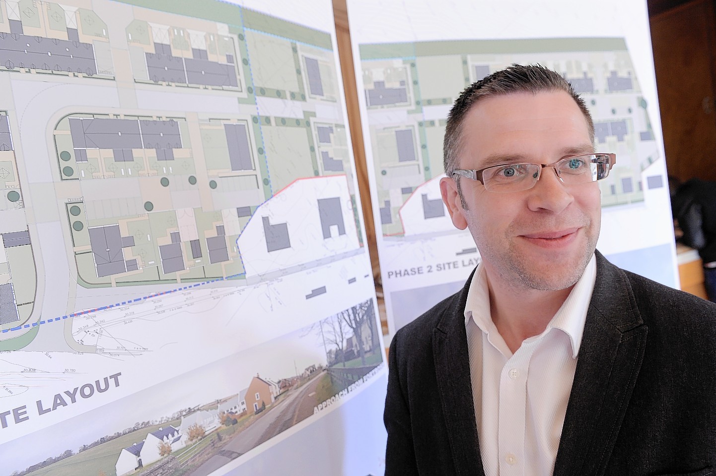 Rory Kellet, of ThreeSixty Architecture, with the plans for Rosemarkie