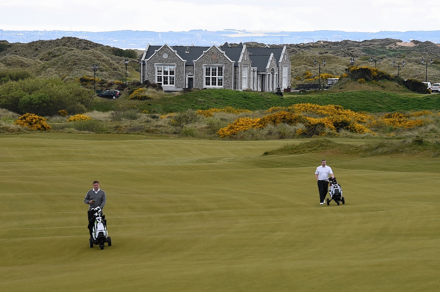 A scenic view with the course in the foreground of the new Trump clubhouse