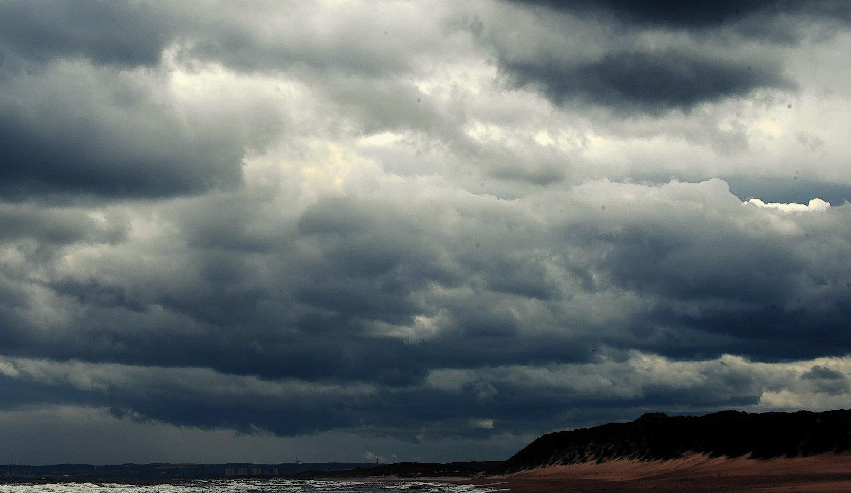 Storm clouds and high winds gather this morning at Balmedie beach