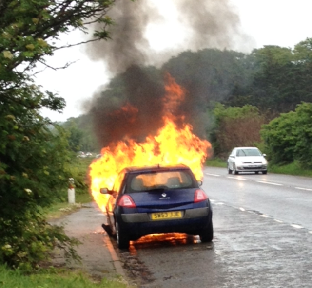 Car on fire outside Elgin on Sunday evening