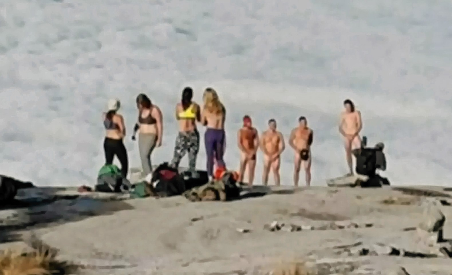 The group of tourists allegedly stripped naked before taking pictures on a mountain peak.