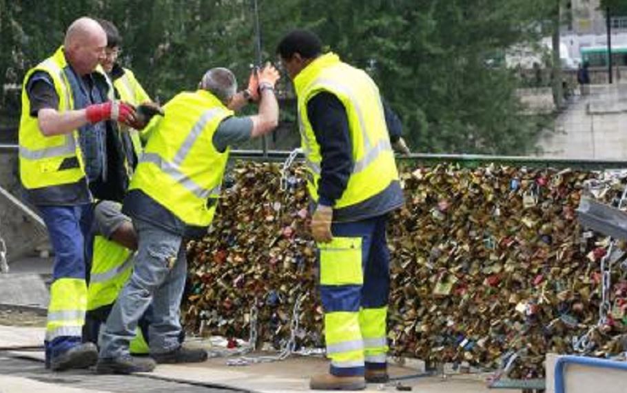 Thousands of padlocks affixed to the famed Pont des Arts bridge are being taken down