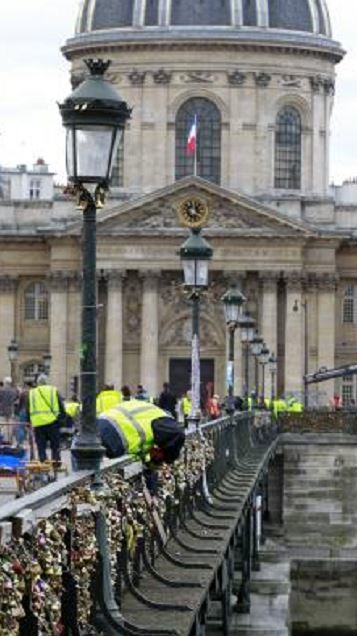 Thousands of padlocks affixed to the famed Pont des Arts bridge are being taken down