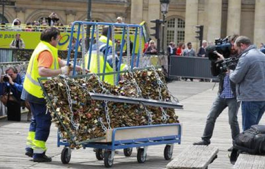 Thousands of padlocks affixed to the famed Pont des Arts bridge are being taken down