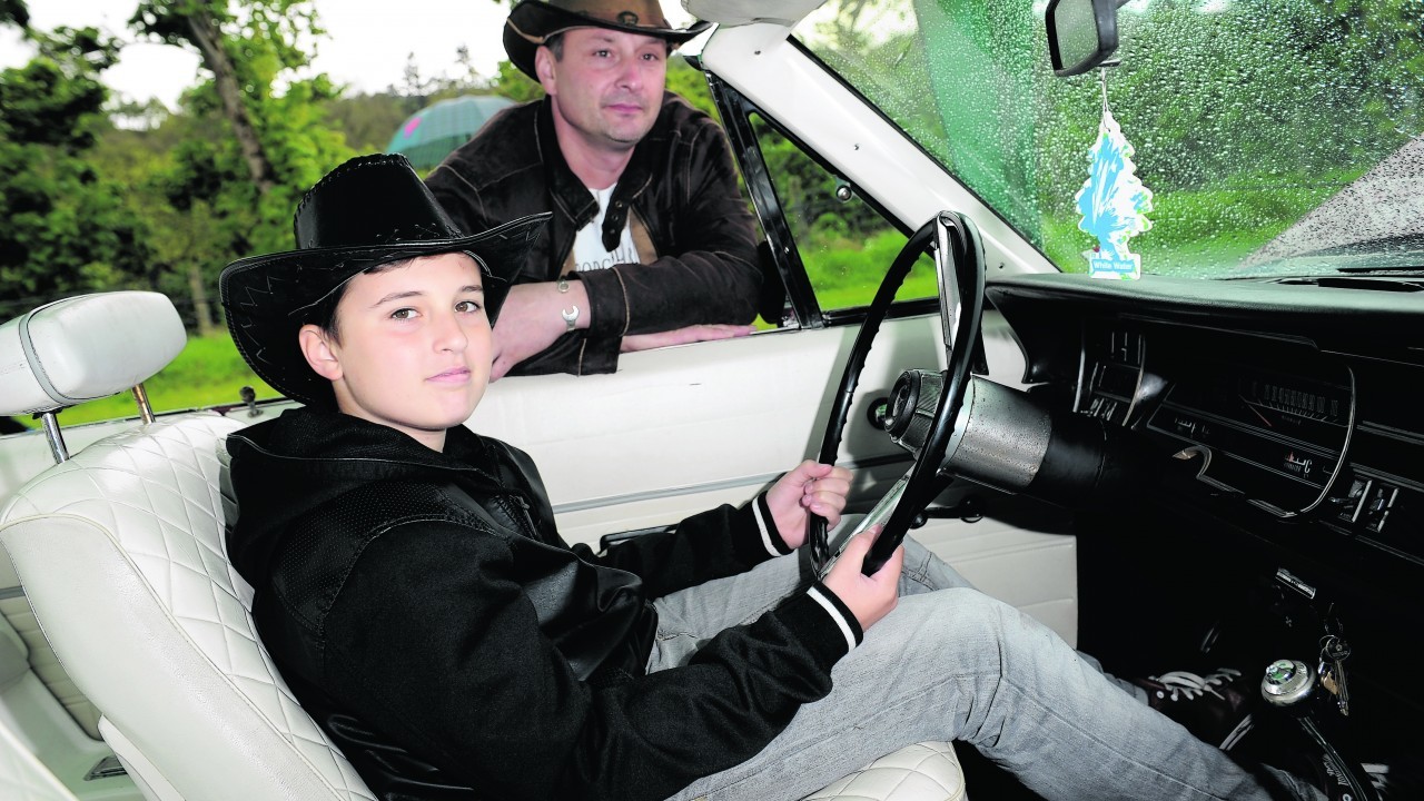 Gregor Barton and son Emil, 13, with his 1968 Dodge Polara Convertible.