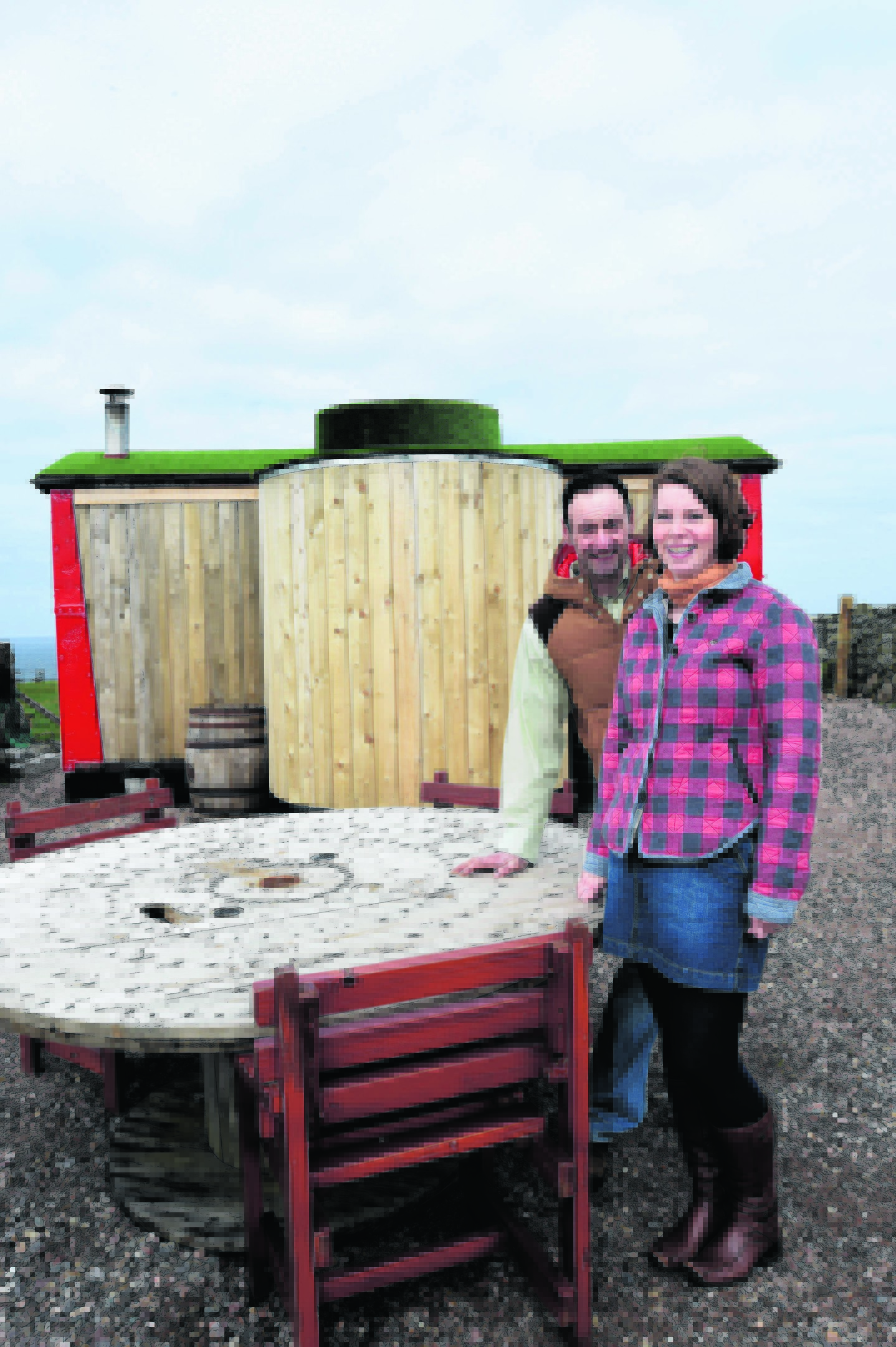 YOUR HOME - RAILWAY CARRIAGE (DUNCAN BROWN) MATTHEW AND CAROLE SHORT AT THE REAR OF THE 1930'S FREIGHT TRAIN CARRIAGE THEY CONVERTED TO A HOLIDAY HOME AT HIGH SEAS HOBBITS, ROSEHEARTY.
