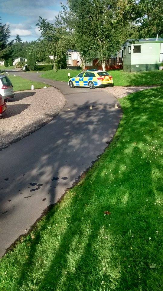 The police vehicles at the Deeside Holiday Park last night