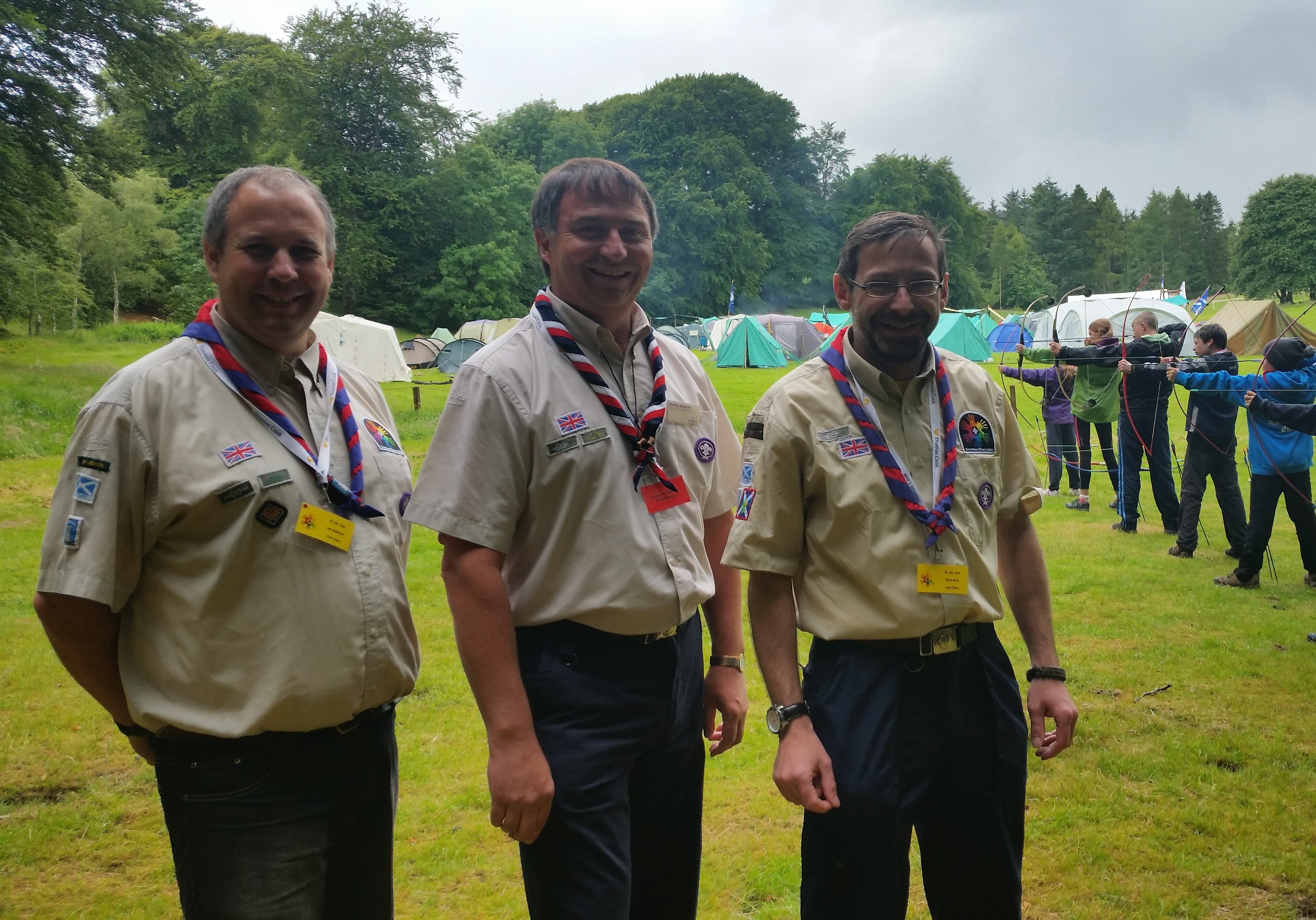 Wayne Bulpitt, the UK Scouts chief commissioner, centre, joined by camp chief Iain Meldrum, left, and Aberdeen district commissioner Mike Winn, right