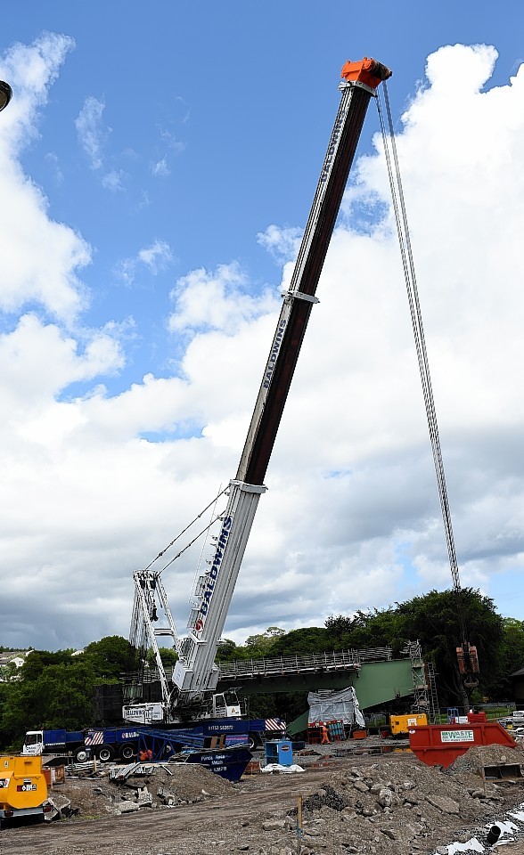 The big crane which will be used to manoeuvre the steel beams into place over the River Don, is being put together on site at the Third Don Crossing.