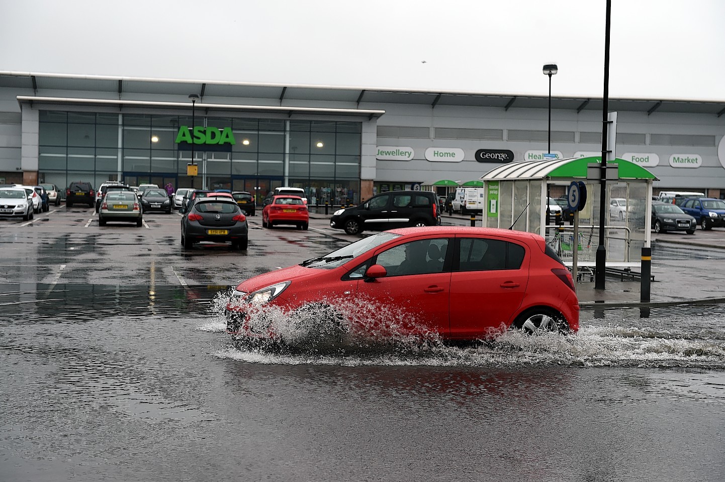 Part of the car park at the Boulevard Shopping centre at Aberdeen Beach is under water.      