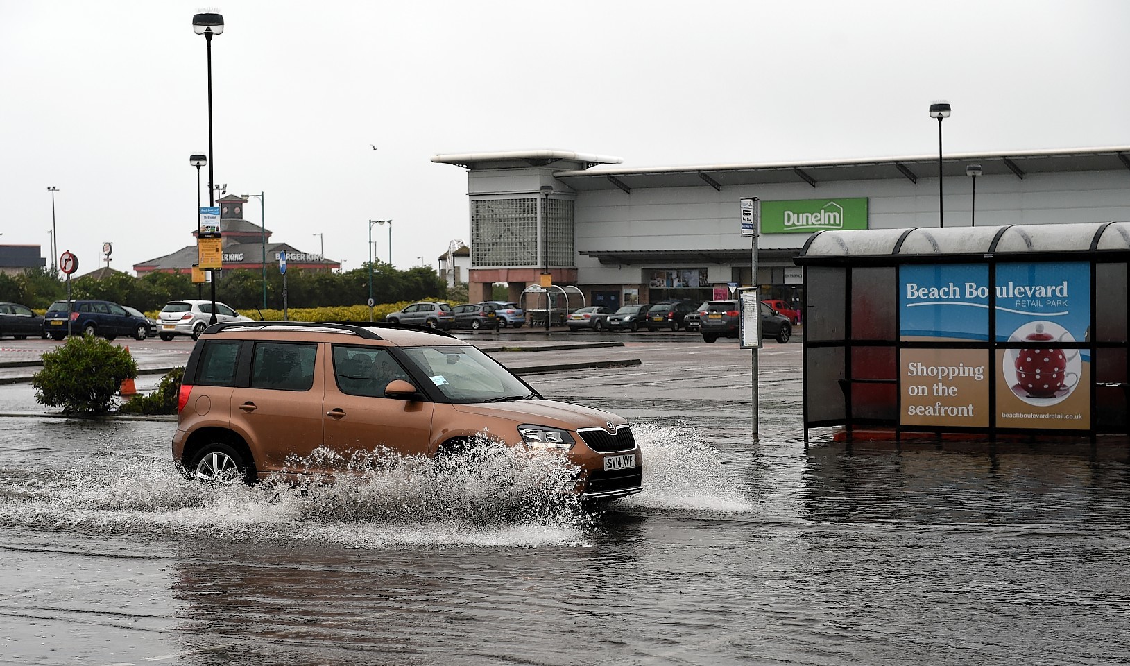 Part of the car park at the Boulevard Shopping centre at Aberdeen Beach is under water.      