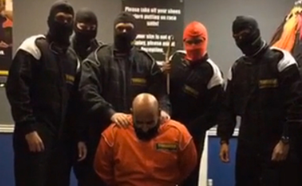 The HSBC workers were dressed in overalls and balaclavas at a go-karting centre when they staged a beheading scene,