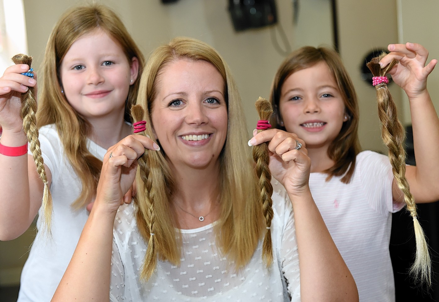 Summer, Pamela and Amber Cameron have donated their hair to the Little Princess Trust