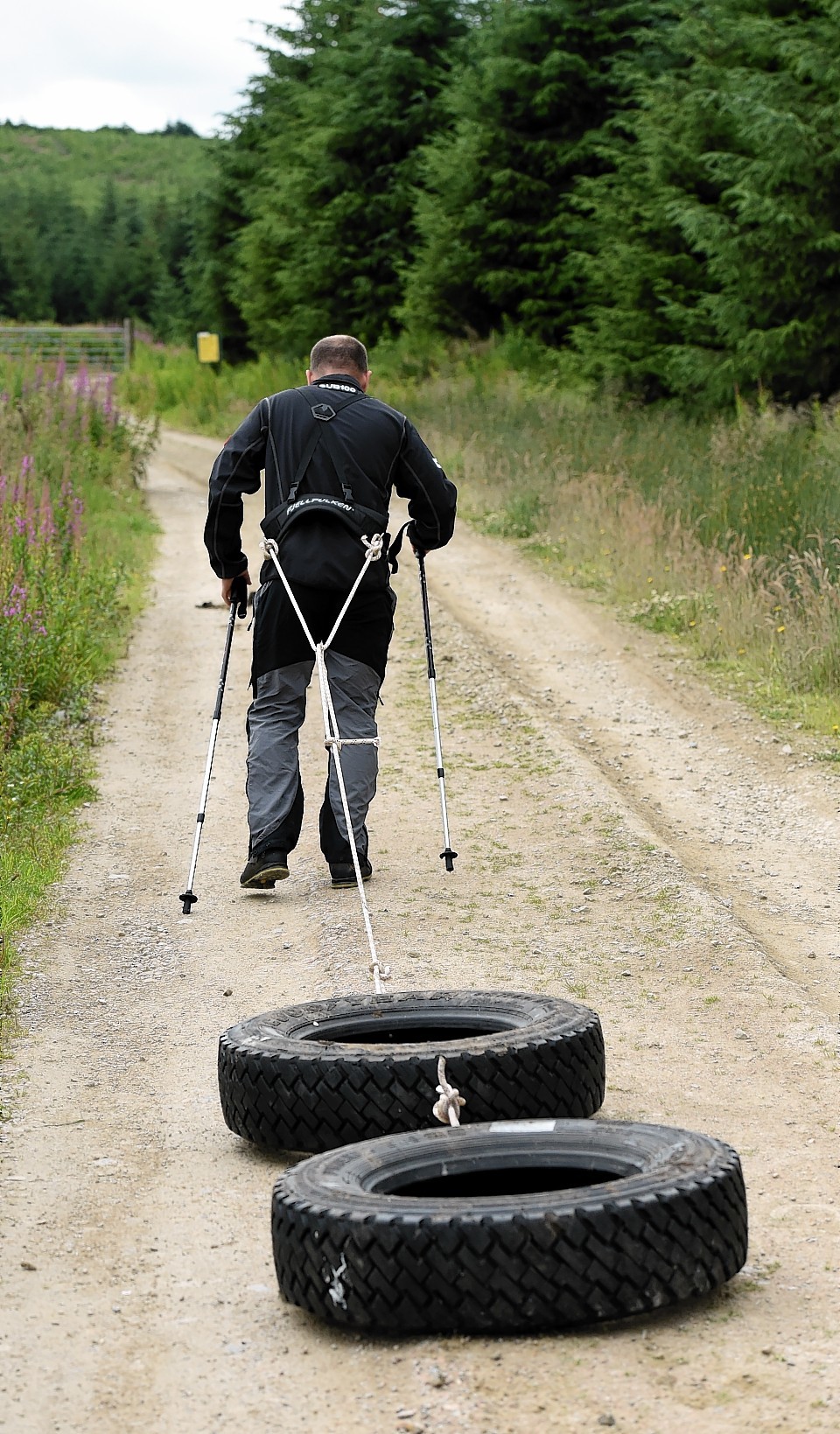 Charlie Paton trains for his forthcoming trip to Antarctica near Durris using Land Rover tyres to mimic the weight of the sledge carrying his supplies. Picture by Kami Thomson.