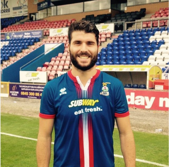 Dani Lopez poses in his new Caley Thistle strip