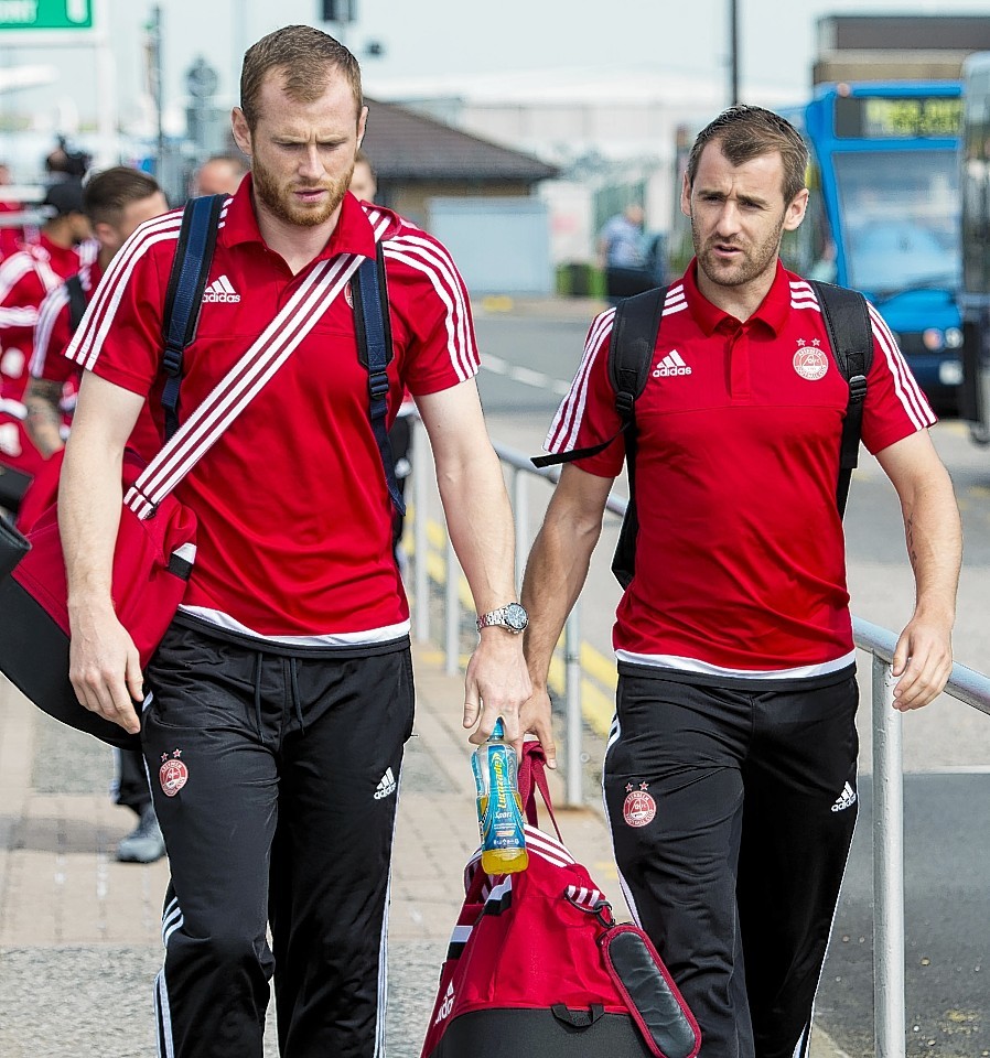 Mark Reynolds (left) and Niall McGinn arrive at Aberdeen Airport ahead of the trip to Macedonia 
