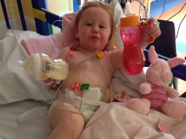 Emily, at  14 months old, recovering from the first part of her stoma reversal in High Dependency at Yorkhill Hospital
