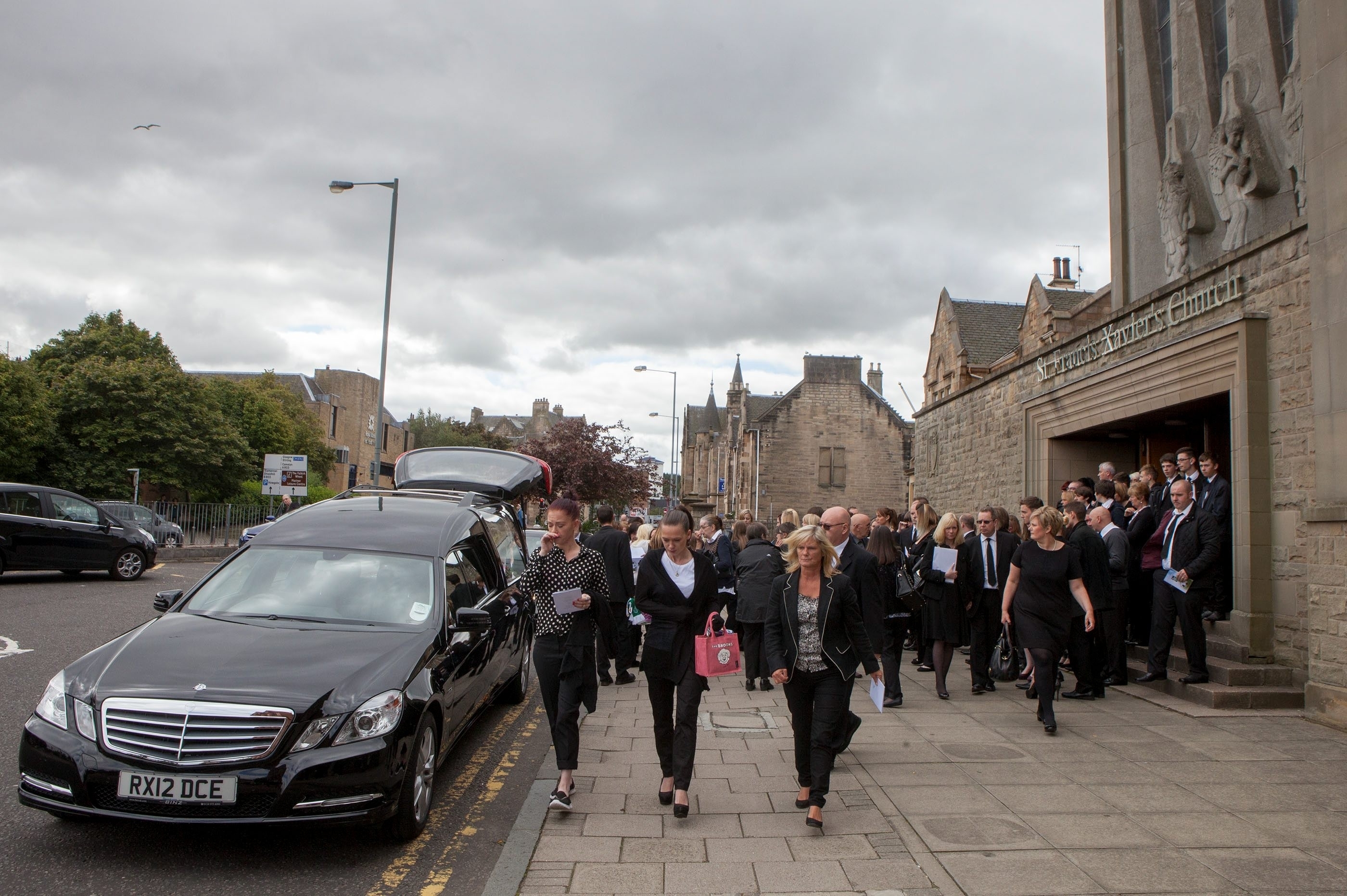 The funeral of John Yuill, took place at St Francis Xavier's Church in Falkirk. 