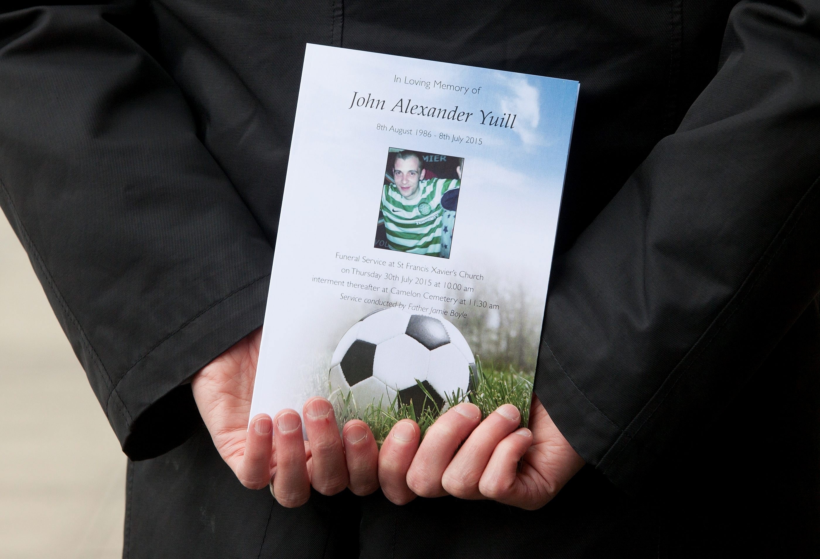 John pictured in his hoops top on the funeral service sheet 