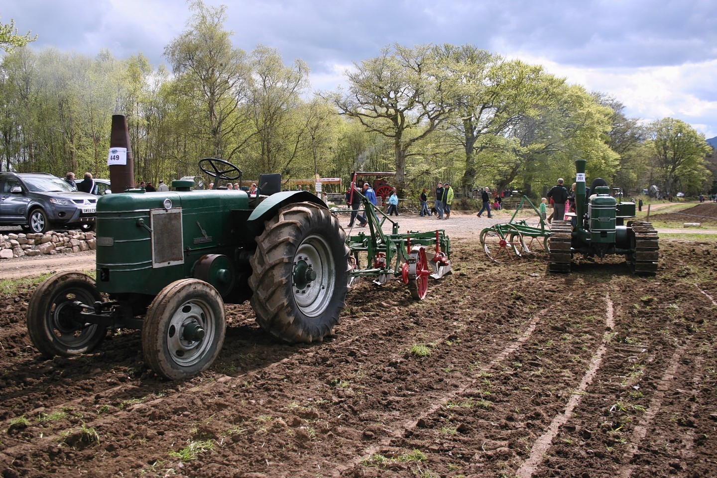 A Field Marshall Series 1 with cultivator in tow at a BA Stores event.