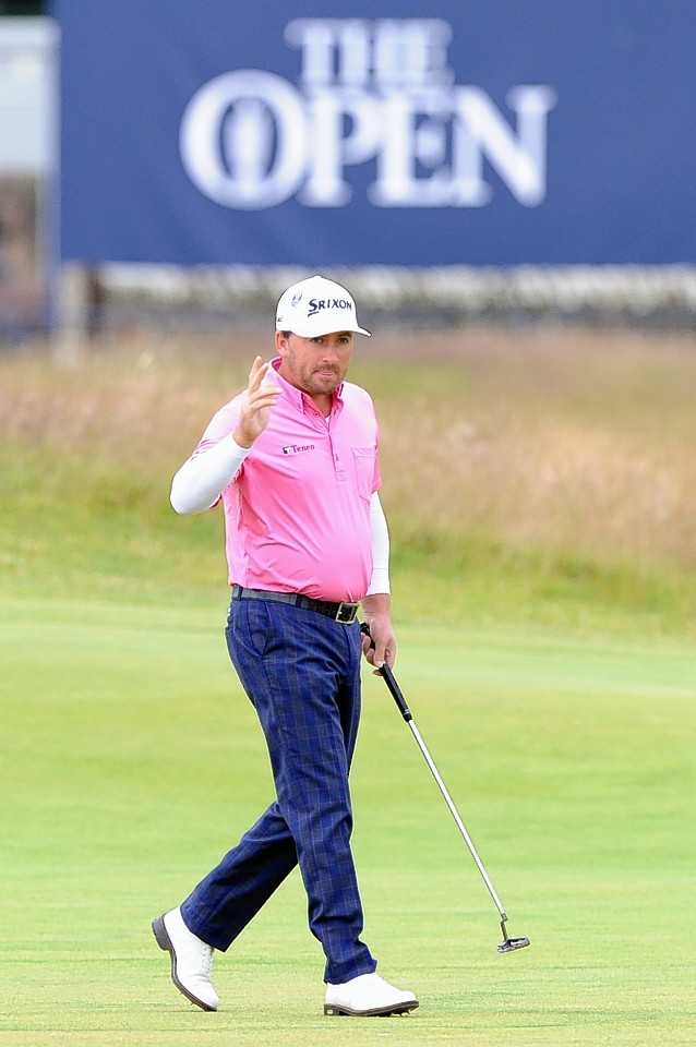 Northern Ireland's Graeme McDowell acknowledges the applause during day five of The Open