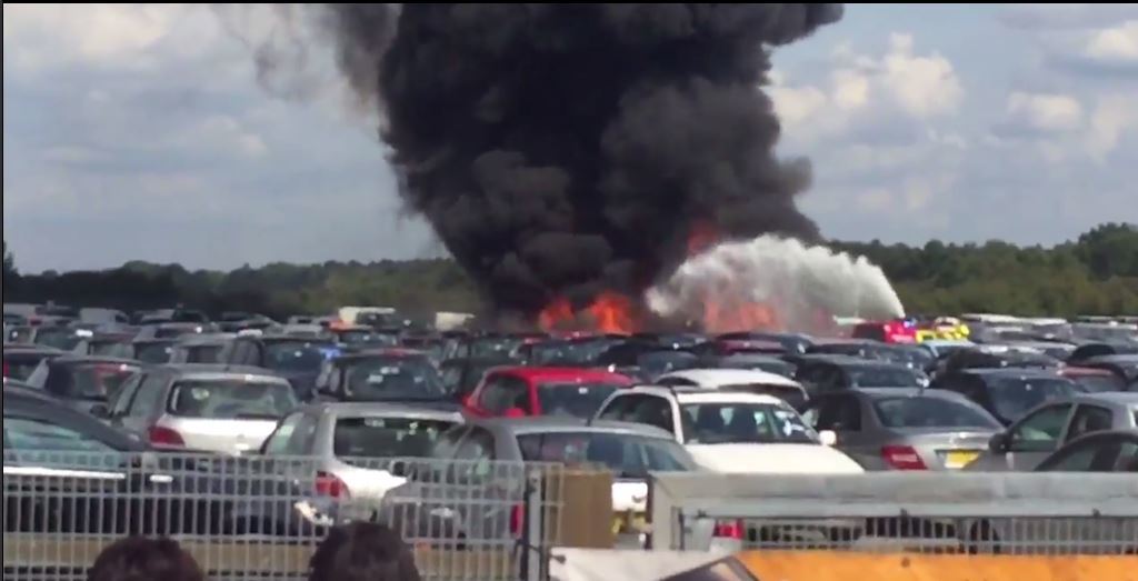 The plane crashed into a car auction