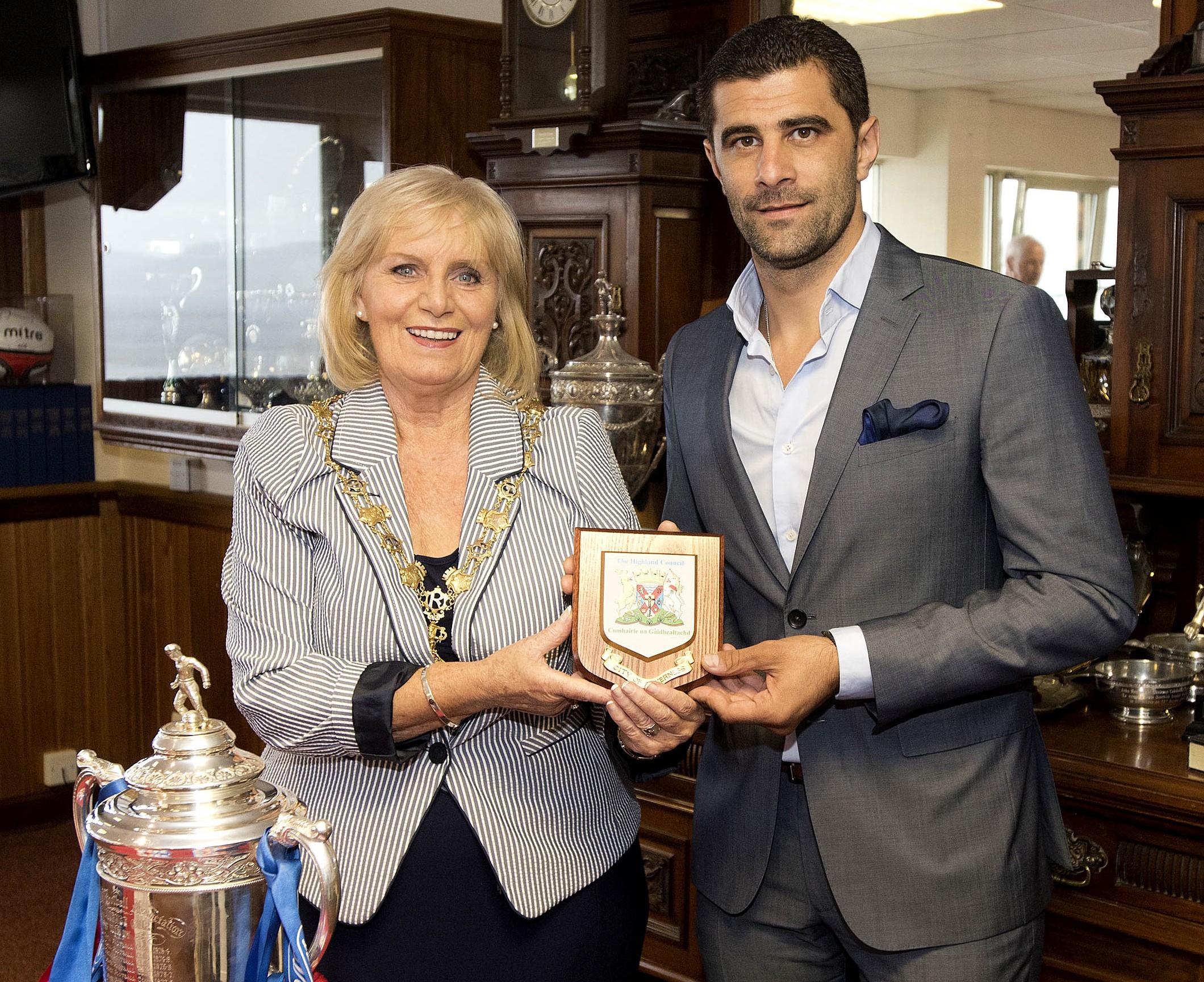 Provost Helen Carmichael presents a plaque to Dani Coman, Astra's President Executive.