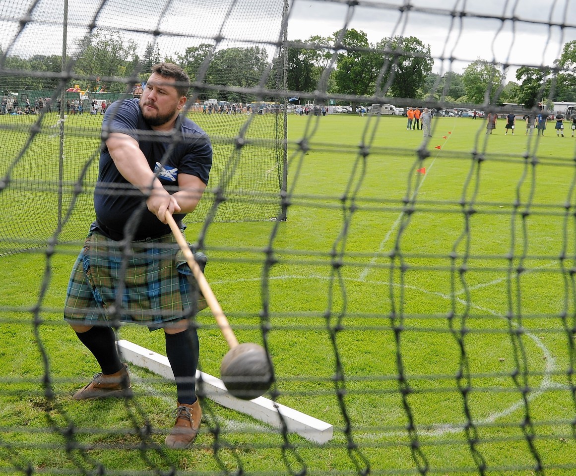 Sinclair Patience of Avoch throws the Scots Hammer.