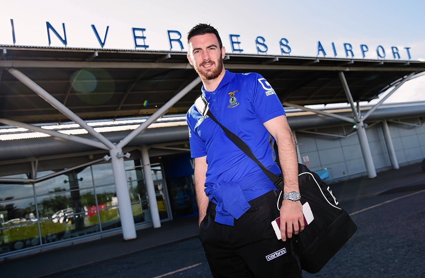 Ross Draper poses outside Inverness Airport as ICT await their flight to Romania.
