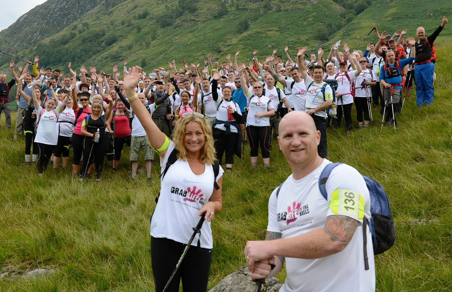 John Harston and his wife Sarah with 120 walkers after his previous Ben Nevis challenge