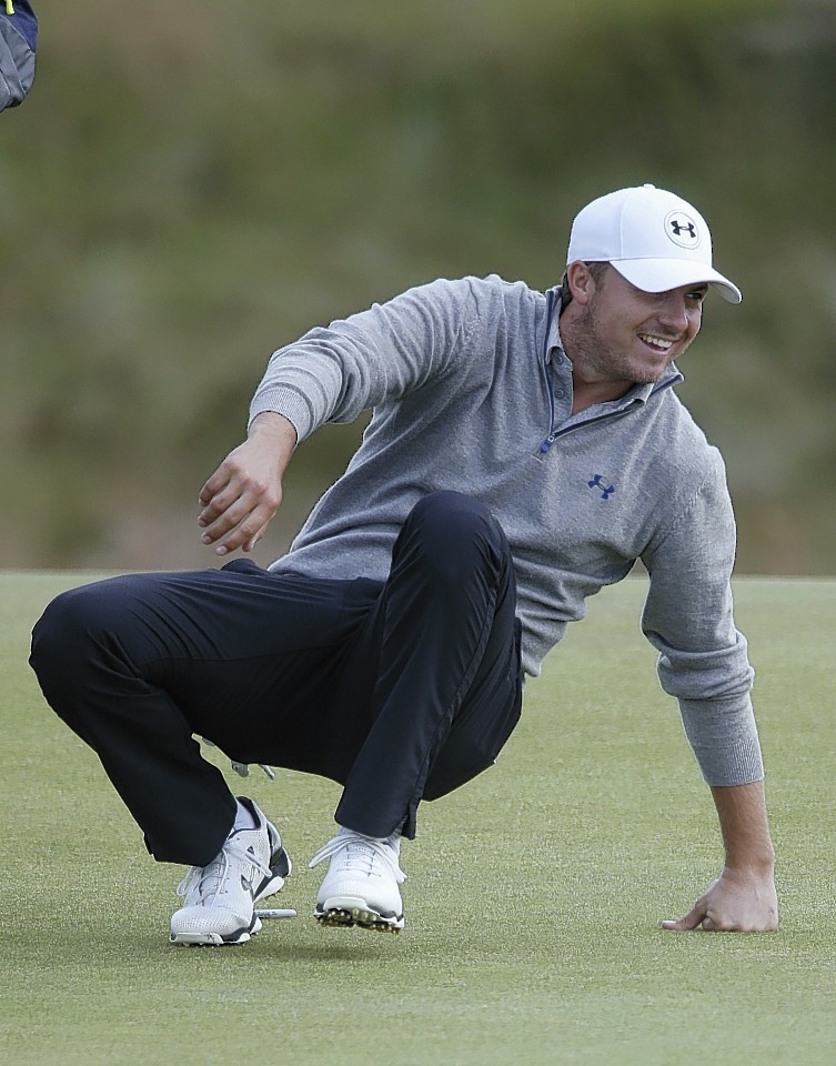  Jordan Spieth misses a putt but manages to see the funny side as he collapses to the ground 