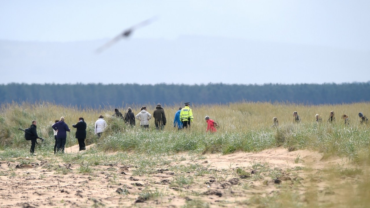 Volunteers join police in the search for missing Lachlan Simpson. Picture by Sandy McCook