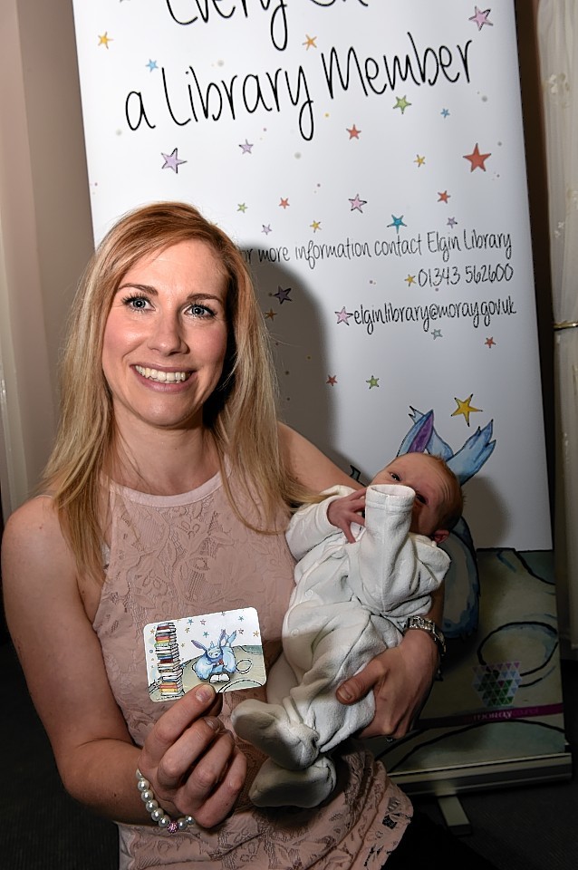 Kathryn Mitchell with her son Lochlan and his new Moray library card