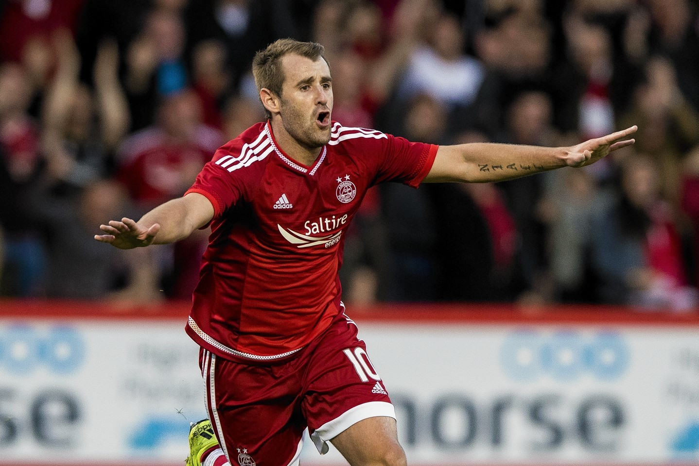 McGinn celebrates netting against Rijeka earlier this season