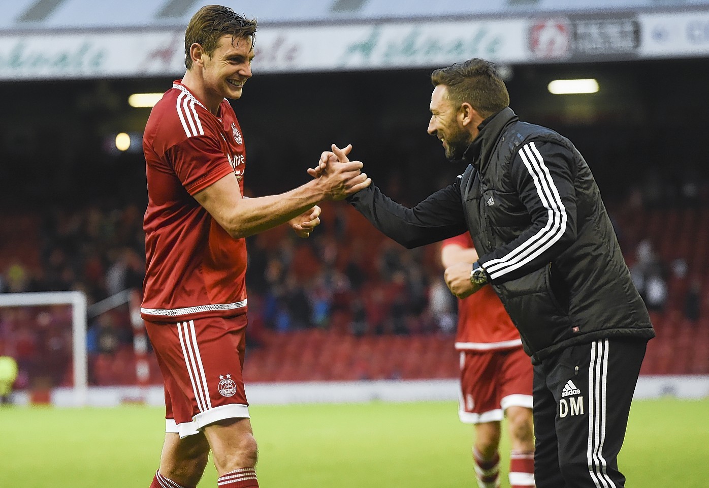 McInnes congratulates Ash Taylor at full time