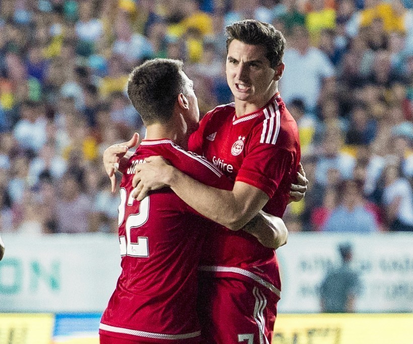 Kenny McLean celebrates his goal with Dons captain Ryan Jack